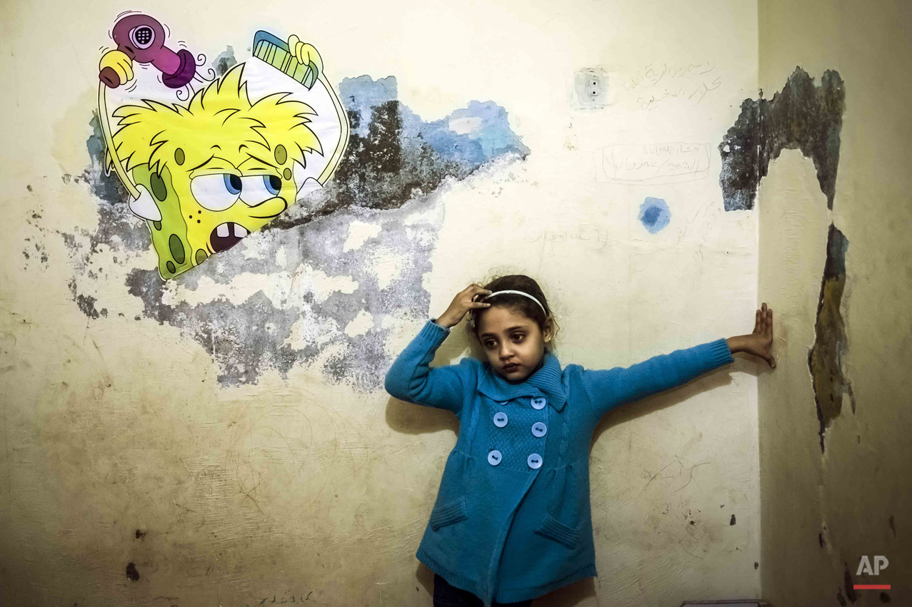  In this picture taken on Feb. 7, 2015, Jana Amr Elbana, a 5-year-old girl whose father supported the Muslim Brotherhood and was shot to death protesting in 2014, stands in her bedroom at her home in Badrashin, south Giza, Egypt. ìKids have different