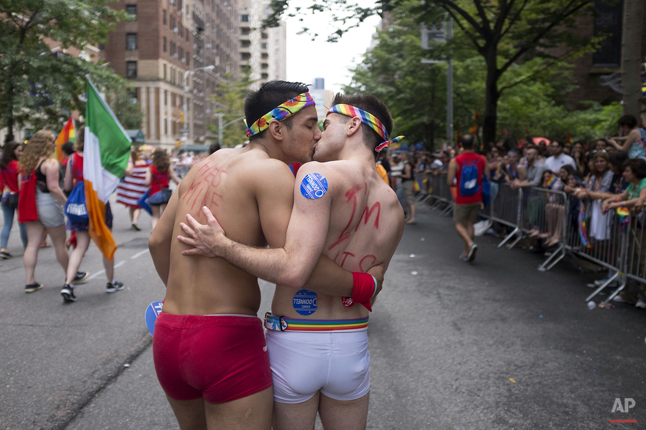  A couple kisses as they participate in the Heritage Pride March in New York, Sunday, June 28, 2015. (AP Photo/Dieu Nalio Chery) 