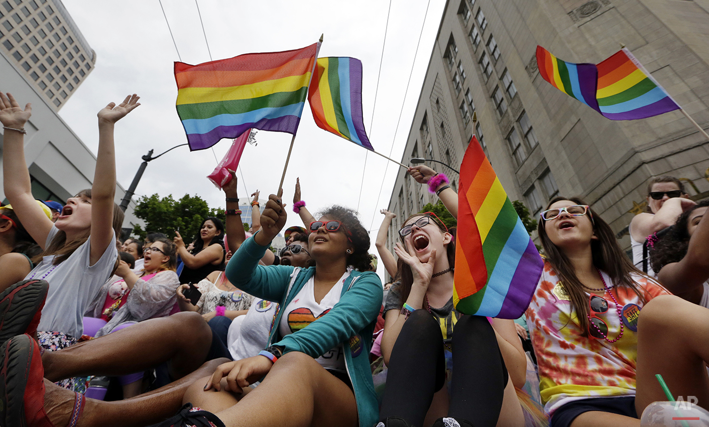  Parade viewers cheer at the 41st annual Pride Parade Sunday, June 28, 2015, in Seattle. Rainbows and good cheer were out in force Sunday as hundreds of thousands of people packed gay pride events from New York City to Seattle, San Francisco to Chica