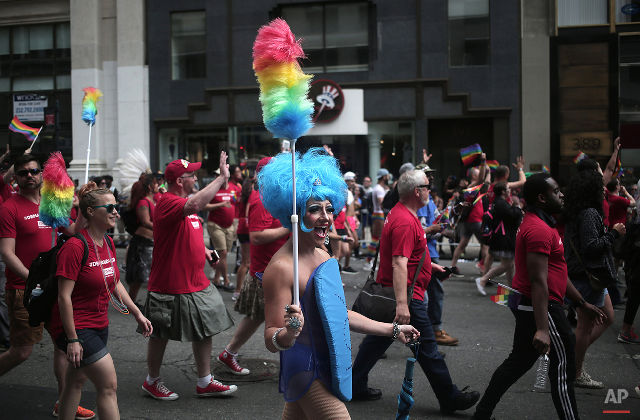  A dressed up participant walks along down Fifth Avenue in New York during the Heritage Pride March, Sunday, June 28, 2015. (AP Photo/Khalil Hamra) 
