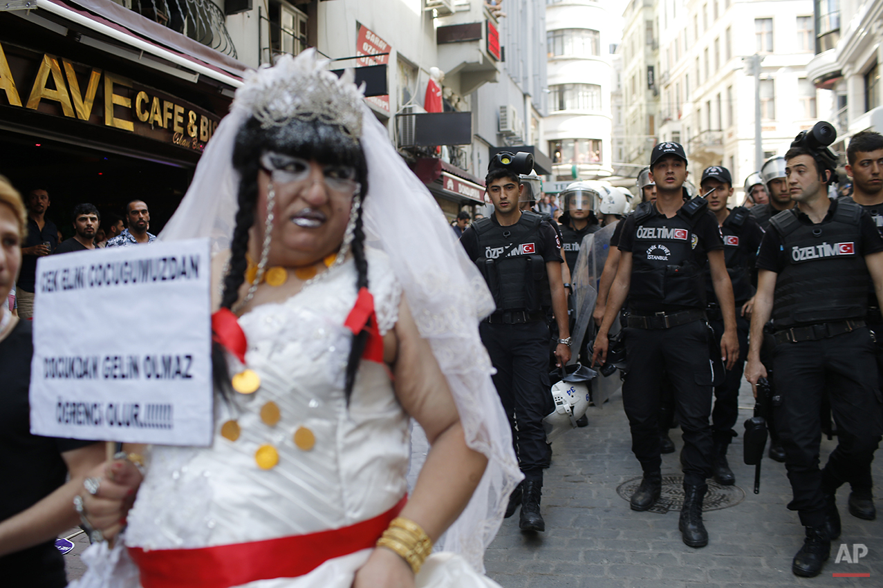  Turkish police walk as they push back participants of a gay pride event in Istanbul, Sunday, June 28, 2015. Turkish police used water cannons and tear gas to clear gay pride demonstrators from Istanbul's central square. It wasn't immediately clear w