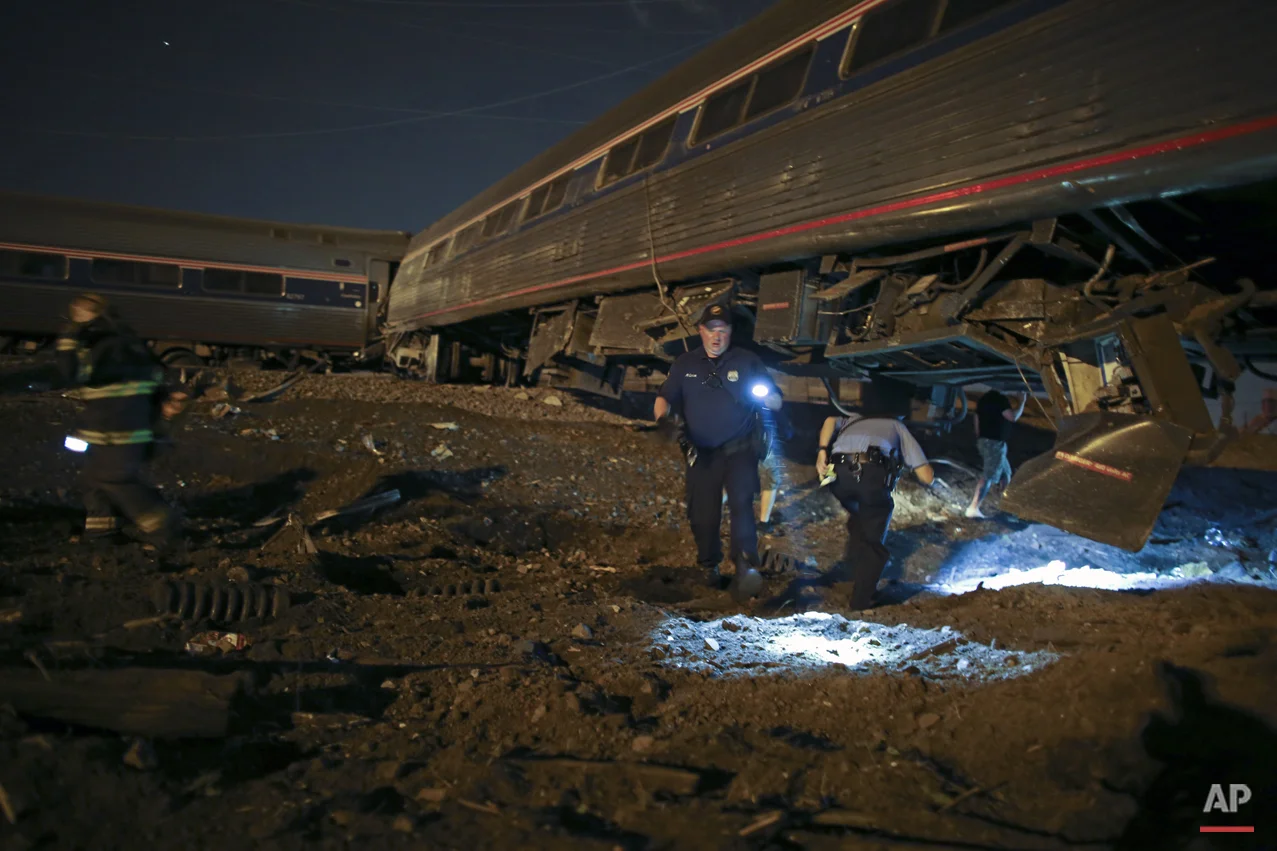  Emergency personnel work the scene of a deadly Amtrak train wreck, Tuesday, May 12, 2015, in Philadelphia. (AP Photo/ Joseph Kaczmarek) 