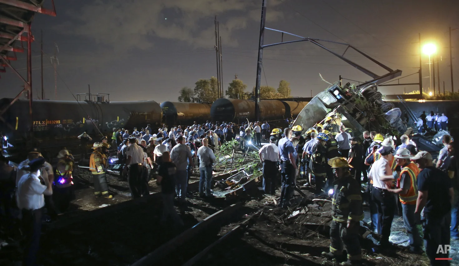 Emergency personnel work the scene of a Amtrak train wreck, Tuesday, May 12, 2015, in Philadelphia. (AP Photo/ Joseph Kaczmarek)