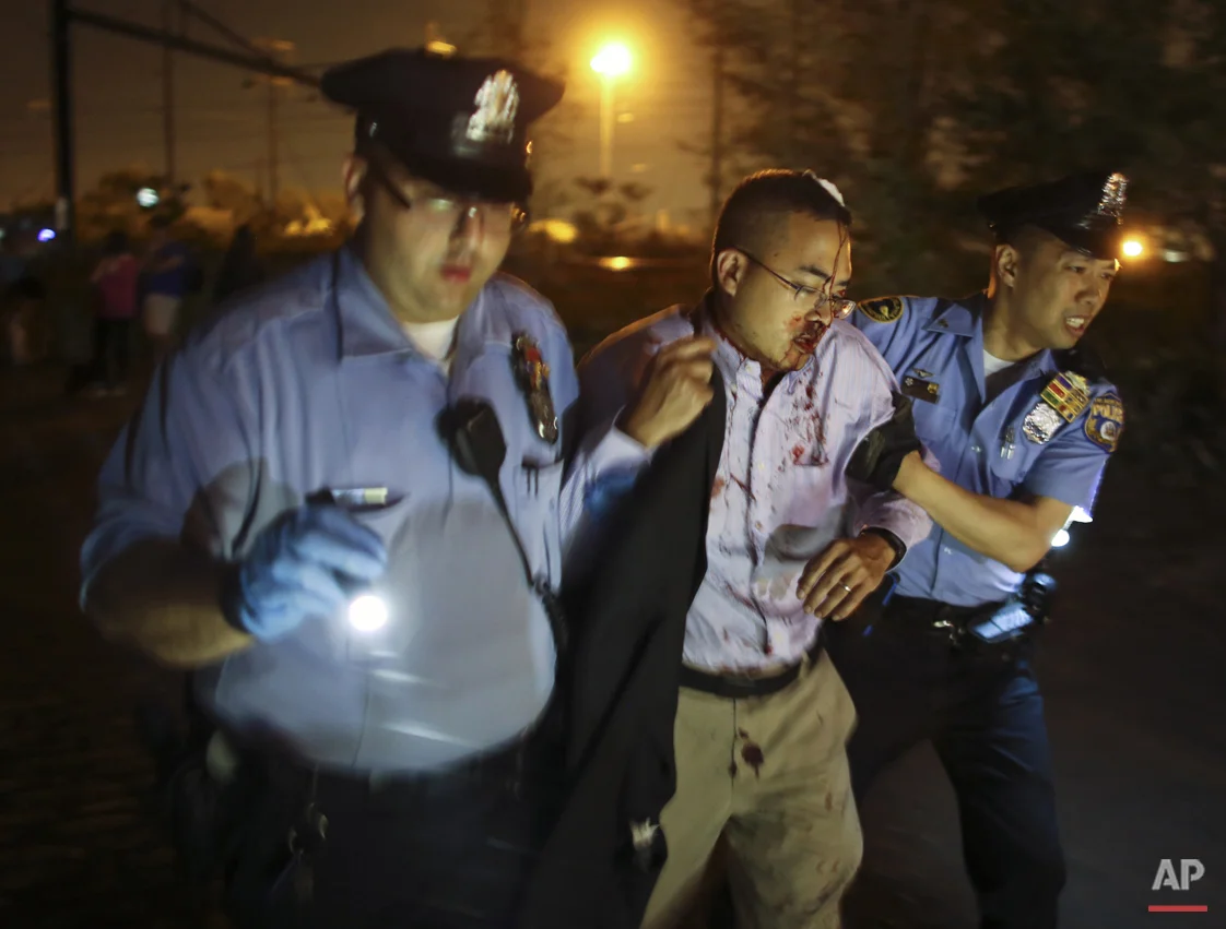  Emergency personnel help a passenger at the scene of a Amtrak train wreck, Tuesday, May 12, 2015, in Philadelphia. (AP Photo/Joseph Kaczmarek) 