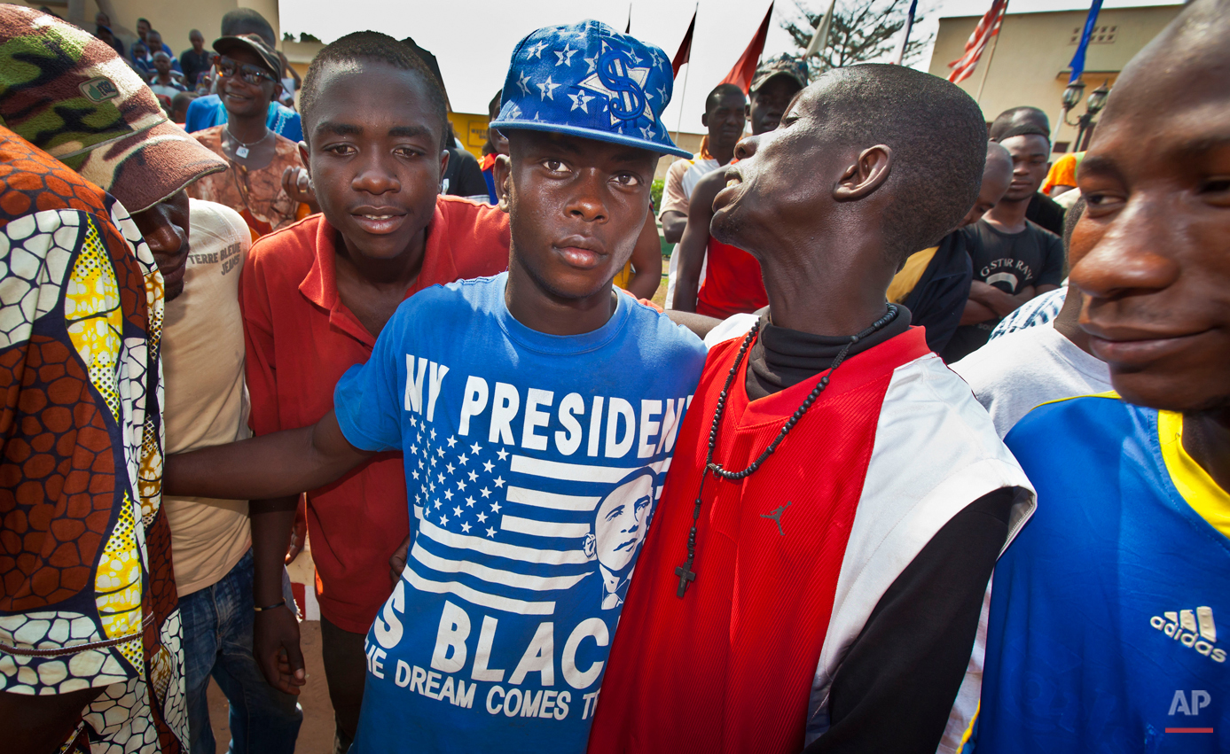  In this Saturday, Jan. 5, 2013 photo, youths attending a protest wear a t-shirt with the face of US President Barack Obama reading "My president is black, the dream comes true", in downtown Bangui, Central African Republic. Barack Obama, the United 