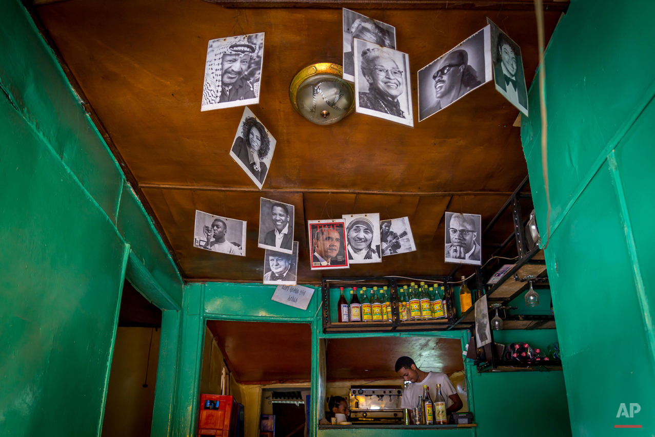  In this photo taken Saturday June 20, 2015, a portrait of U.S. President Barak Obama is displayed with other famous people in the National Cafe in Addis Ababa, Ethiopia. Barack Obama, the United Statesí first African-American president, has captured