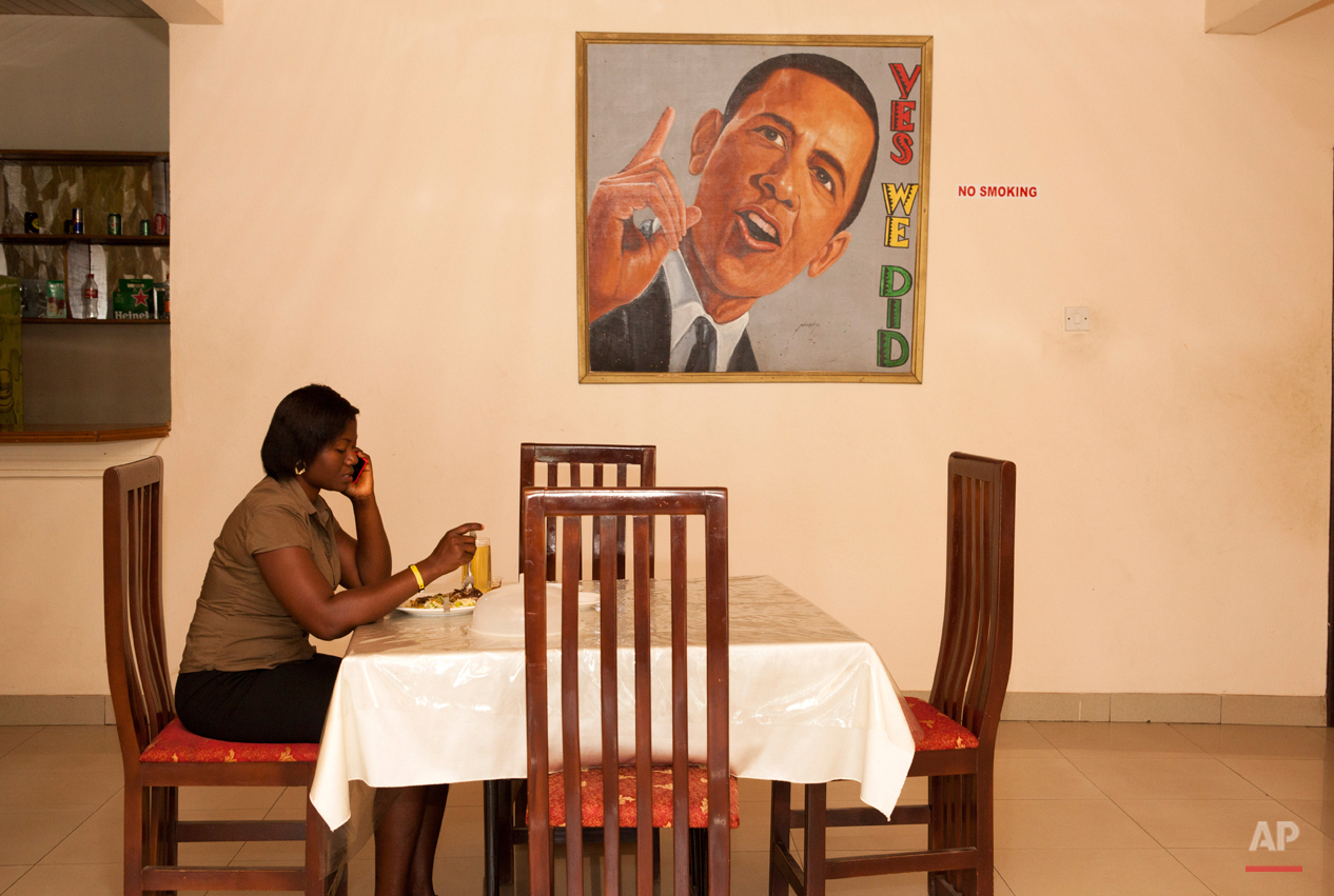  In this picture taken on Saturday, July 4, 2015, a woman sits in the restaurant of  a hotel named after U.S. President Barak Obama in Accra, Ghana. Barack Obama, the United Statesí first African-American president, has captured the imagination of pe