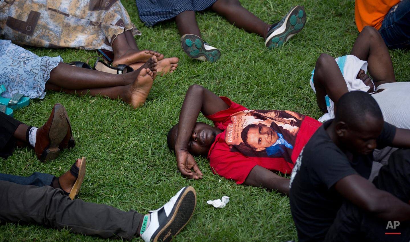  In this Monday April 7, 2014 photo, a Rwandan man wears a shirt showing the face of U.S. President Barack Obama, at a public ceremony to mark the 20th anniversary of the Rwandan genocide, in Kigali, Rwanda. Barack Obama, the United Statesí first Afr