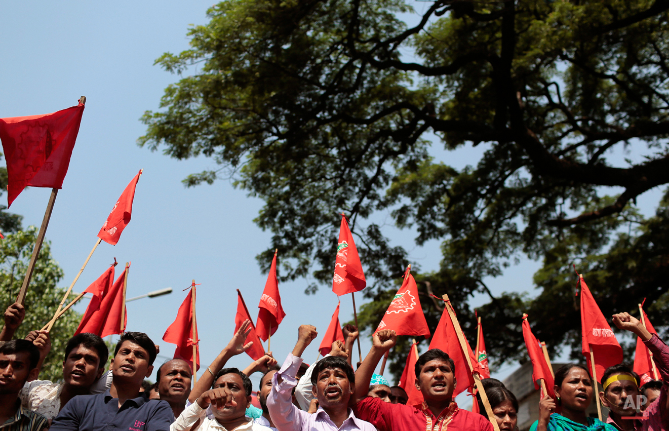  Bangladeshi garment workers and activists shout slogans during a May Day rally demanding better work environment, in Dhaka, Bangladesh, Friday, May 1, 2015. May 1 is celebrated as the International Labor Day or May Day across the world. (AP Photo/A.