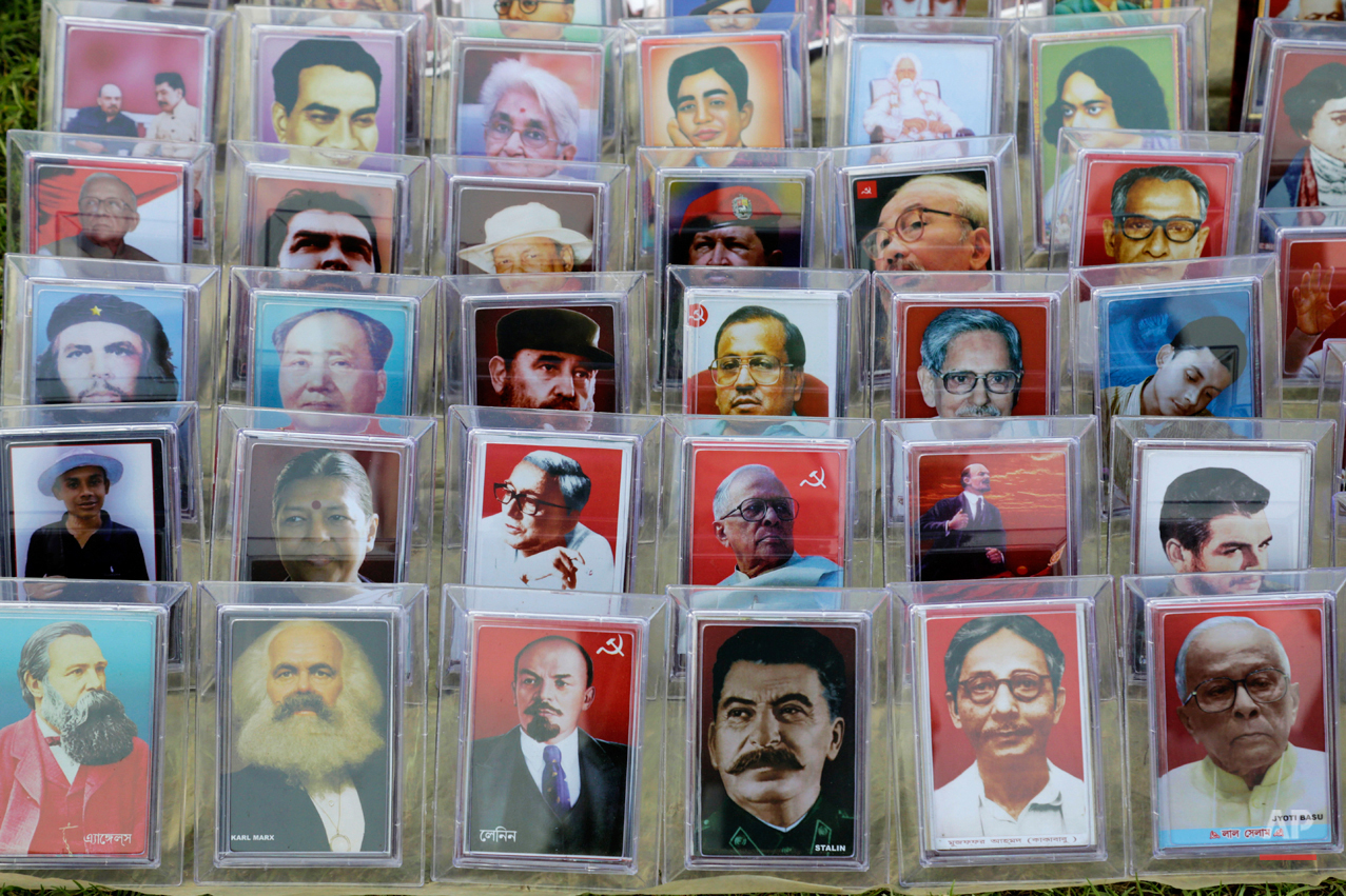  Portraits of Indian and world communist leaders is displayed for sale during a rally organized by left front trade unions celebrating International Labor Day, or May Day, in Kolkata, India , Friday, May 1, 2015. (AP Photo/Bikas Das) 