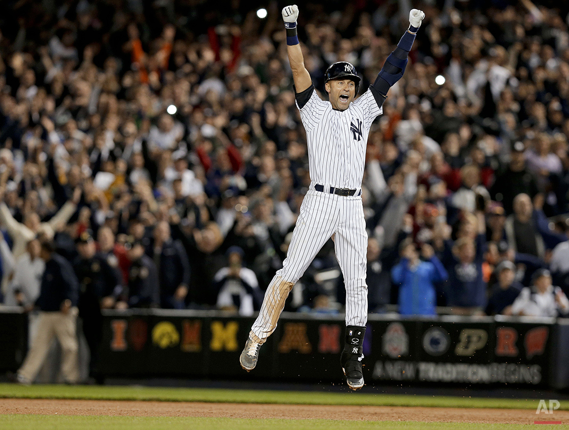  New York Yankees' Derek Jeter jumps after hitting the game-winning single against the Baltimore Orioles in the ninth inning of a baseball game, Thursday, Sept. 25, 2014, in New York. The Yankees won 6-5. (AP Photo/Julie Jacobson) 