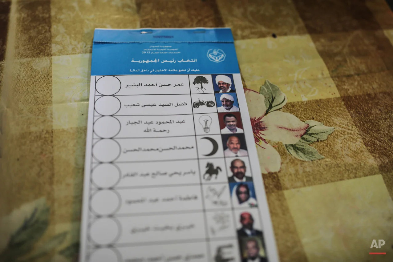  A stack of ballots shows candidates die president including the country's longtime autocrat Omar al-Bashir, top, inside a polling station on the first day of Sudan's presidential and legislative elections, in Khartoum, Sudan, Monday, April 13, 2015.