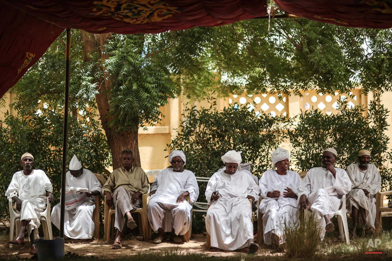  In this Saturday, April 11, 2015 photo, members of Sudanese opposition parties take part in a sit-in the headquarters of Umma, one of Sudanís biggest opposition parties, in Khartoum, Sudan, to denounce the upcoming presidential elections where longt