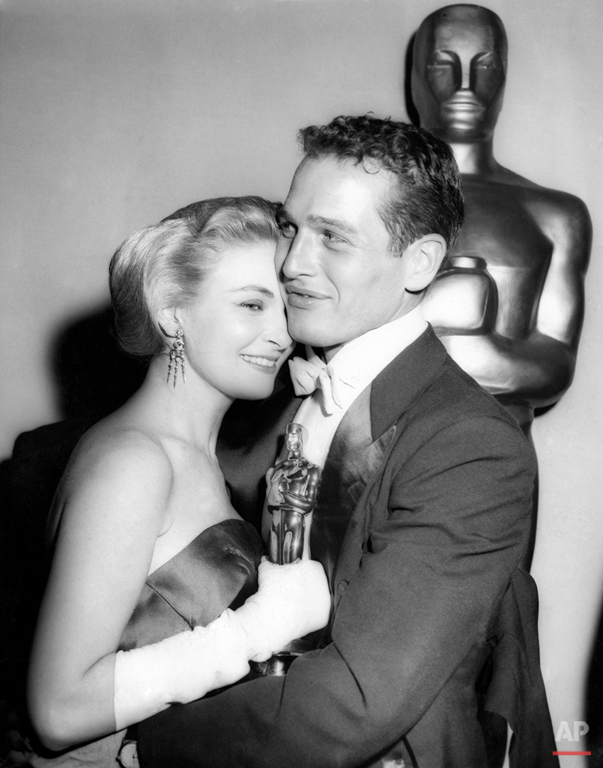  Oscar-winning actress Joanne Woodward is embraced by her husband, actor Paul Newman, backstage at the 30th Academy Award presentations in Hollywood, Calif., March 26, 1958. Woodward won best actress for her role in the motion picture The Three Faces