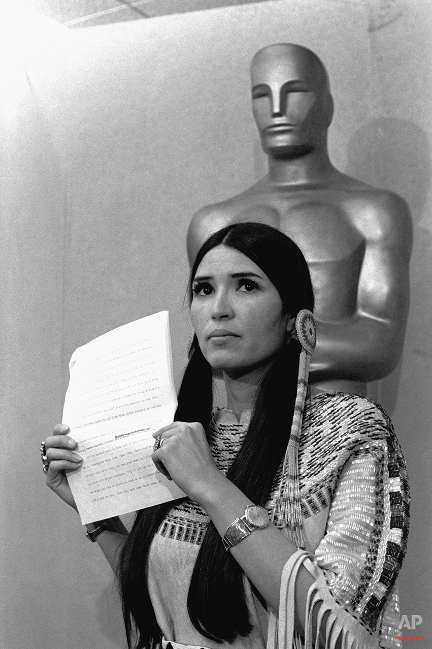  A woman in Native American Indian dress, who indentified herself as Sacheen Littlefeather, tells the audience at the Academy Awards ceremony in Los Angeles March 27, 1973, that Marlon Brando was declining to accept his Oscar as best actor for his ro