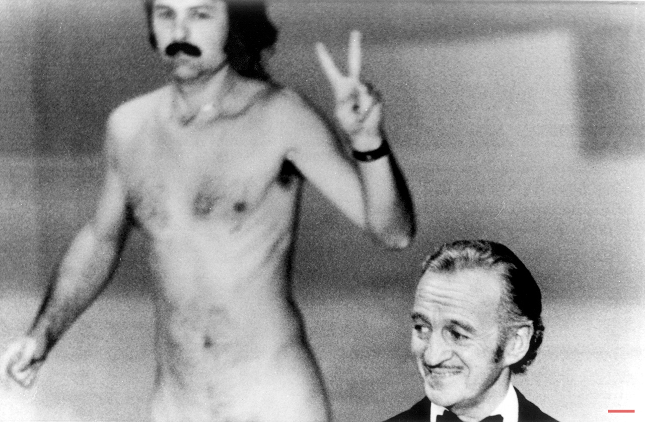  A streaker performs at academy show. David Niven isn't quite sure what's happening behind him as a streaker crosses the stage near the end of the Academy Awards show in Los Angeles tonight. He later identified himself as Robert Opel. (AP Photo)  