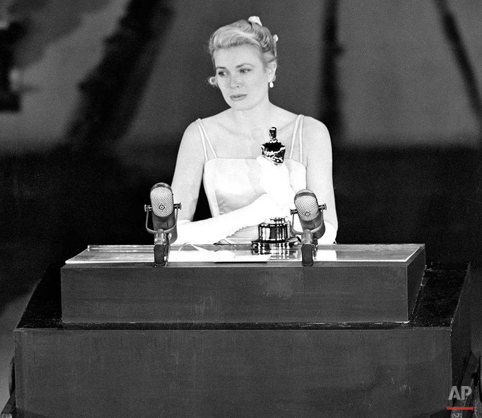 Grace Kelly accepts the Oscar for Best Actress for her role in "The Country Girl," at the Academy Awards, March 30, 1955. (AP Photo)