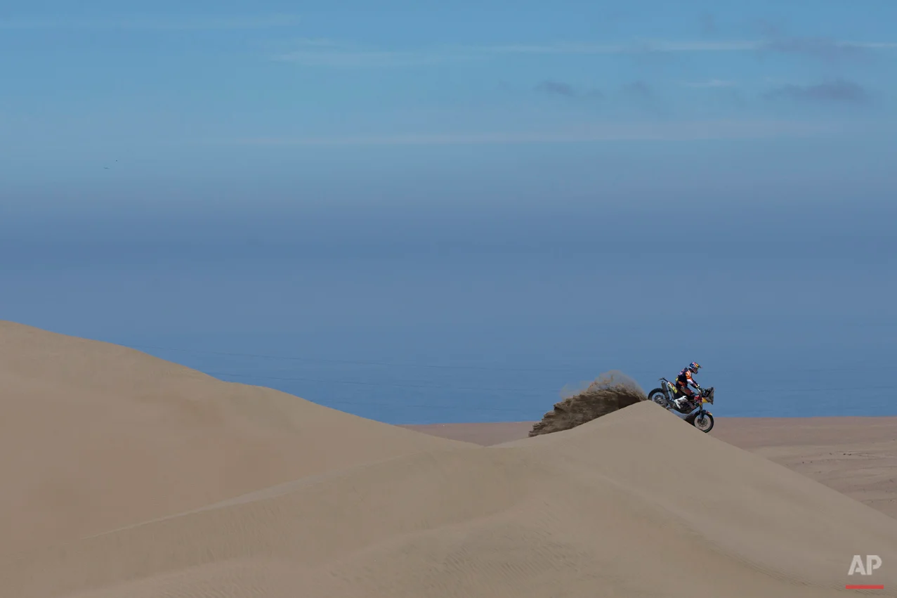 KTM rider Marc Coma of Spain races during the sixth stage of the Dakar Rally 2015 between the cities of Antofagasta and Iquique, Chile, Friday, Jan. 9, 2015. The race will finish on Jan. 17, passing through Bolivia and Chile before returning to Argentina where it started. (AP Photo/Felipe Dana)