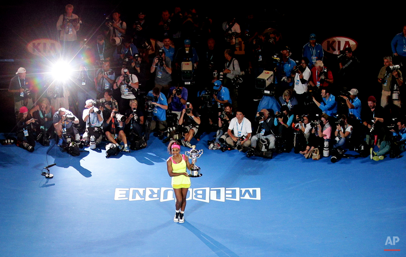  Serena Williams of the U.S. poses the trophy after defeating Maria Sharapova of Russia in the women's singles final at the Australian Open tennis championship in Melbourne, Australia, Saturday, Jan. 31, 2015. (AP Photo/Rob Griffith) 