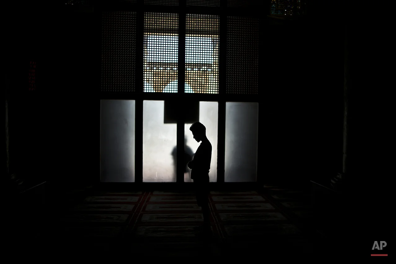 A Muslim youth, prays inside the Dome of the Rock mosque in the Al-Aqsa mosque compound, the third holiest site in Islam and referred to by Jews as the Temple Mount, during the holy fasting month of Ramadan, in Jerusalem's Old City, Wednesday, July 16, 2014. Muslims throughout the world are celebrating the holy fasting month of Ramadan, when observers fast from dawn till dusk. (AP Photo/Muhammed Muheisen)