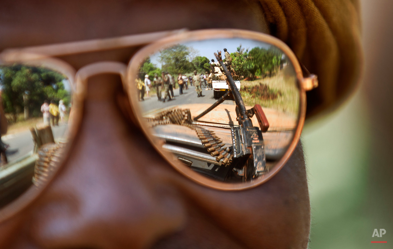 A Chadian soldier wearing reflective sunglasses observes the convoy ahead of him, as Chadian soldiers who are fighting in support of Central African Republic president Francois Bozize, ride on the road leading to Damara, about 70km (44 miles) north 