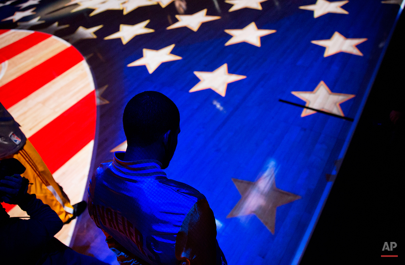  Cleveland Cavaliers’ A.J. Price stands for the National Anthem before the start of an NBA basketball game against the Atlanta Hawks, Tuesday, Dec. 30, 2014, in Atlanta. (AP Photo/David Goldman) 