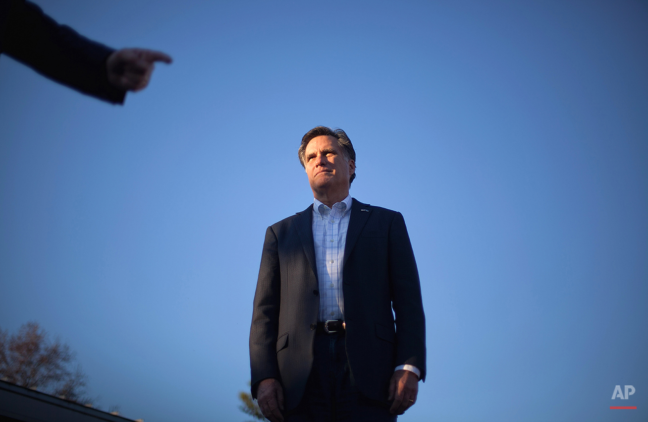  Republican presidential candidate former Massachusetts Gov. Mitt Romney is pointed to by Sen. John McCain, R-Ariz., at a campaign event Thursday, Jan. 5, 2012, in Charleston, S.C. (AP Photo/David Goldman) 