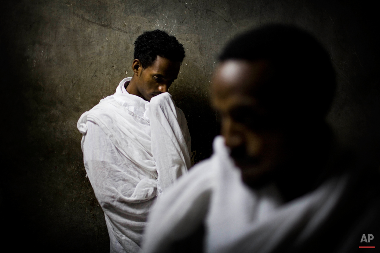  Ethiopian Orthodox Christian pilgrims pray inside the Church of the Holy Sepulcher, traditionally believed to be the site of the crucifixion of Jesus Christ, during the Eastern Orthodox Easter week in Jerusalem's Old City, Wednesday, March 31, 2010.