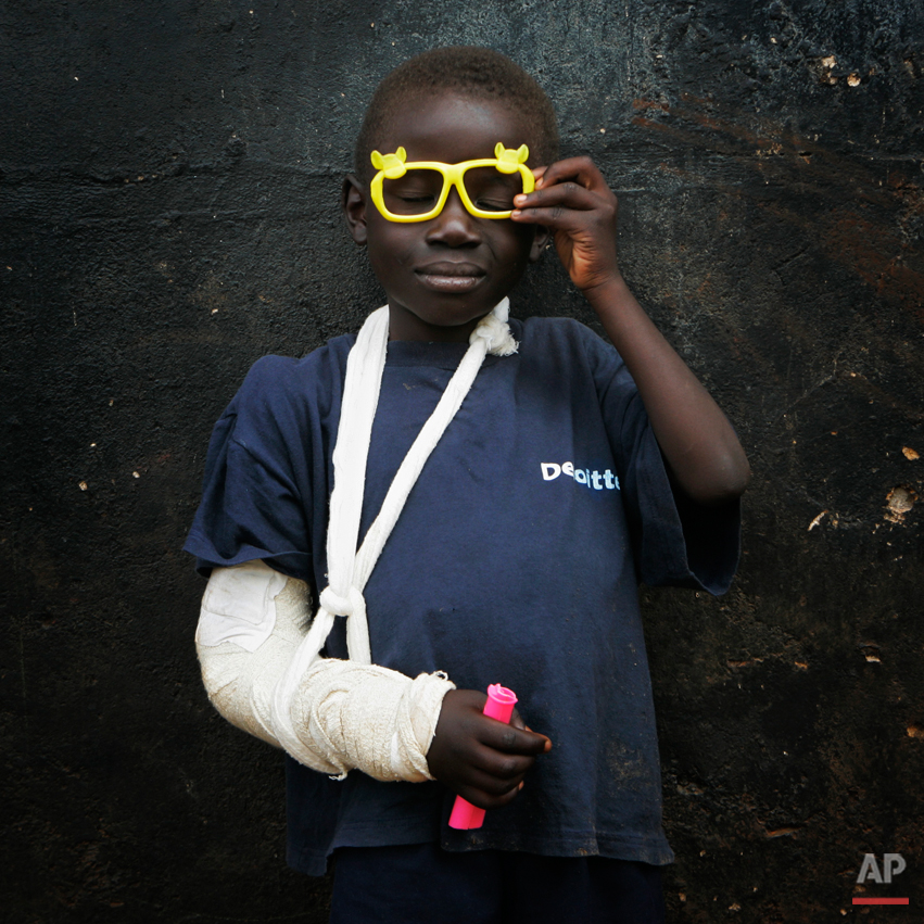 Glen Amadi, 6, poses in an orphanage on the outskirts of Nairobi, Kenya, Friday Feb. 15, 2008. Amadi says he can't remember where he lives. His mother's name is Eliza, he says, and she braids hair in a salon run by a woman he calls "Mama Dana." All the orphanage workers know is that he was found at a nearby camp for displaced families. Waves of ethnic and political attacks since Kenya's disputed Dec. 27 election have uprooted more than half a million people. In the chaos, parents and children lost track of each other. In addition to more than 1,000 people killed, about 400 children were found alone, without adults. (AP Photo/Bernat Armangue)
