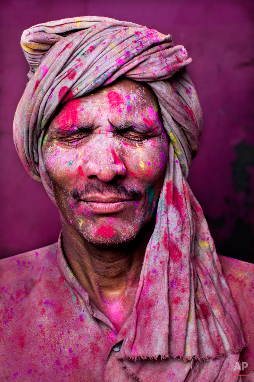  Bachhu Singh, an Indian Hindu man from Baumchalla, poses for a portrait during Lathmar Holy festival, in Barsana 115 kilometers ( 71 miles) from New Delhi, India, Sunday, March 9, 2014. The colorful holiday, celebrated mainly in India and Nepal, mar