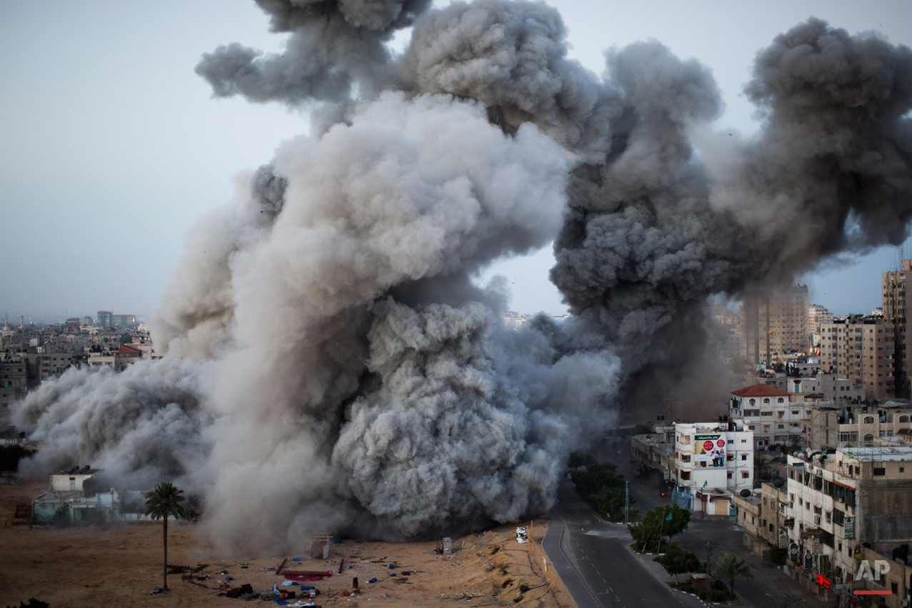 Smoke rises after an Israeli forces strike in Gaza City, Sunday, Nov. 18, 2012. The Israeli military widened its range of targets in the Gaza Strip on Sunday to include the media operations of the Palestinian territory's Hamas rulers, sending its aircraft to attack two buildings used by both Hamas and foreign media outlets. (AP Photo/Bernat Armangue)