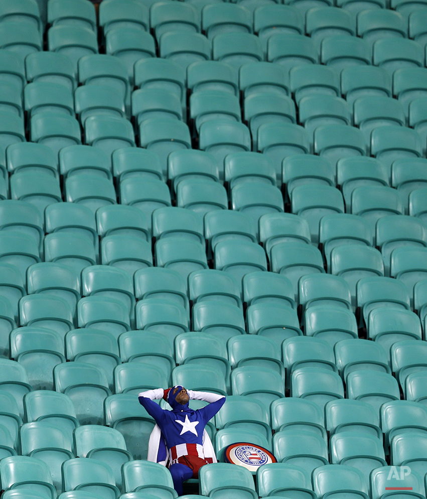  A lone USA supporter dressed as 'Captain America' sits in the stands after Belgium defeated the USA 2-1 in extra time to advance to the quarterfinals during the World Cup round of 16 soccer match between Belgium and the USA at the Arena Fonte Nova i