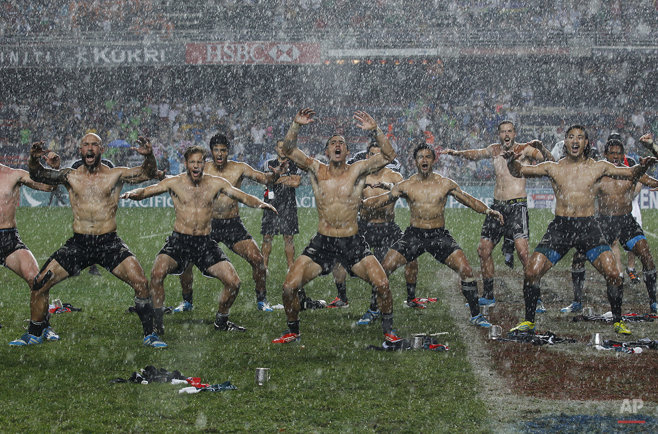  The New Zealand rugby team dance after winning the Hong Kong Sevens rugby tournament against England in Hong Kong, Sunday, March 30, 2014. (AP Photo/Kin Cheung) 