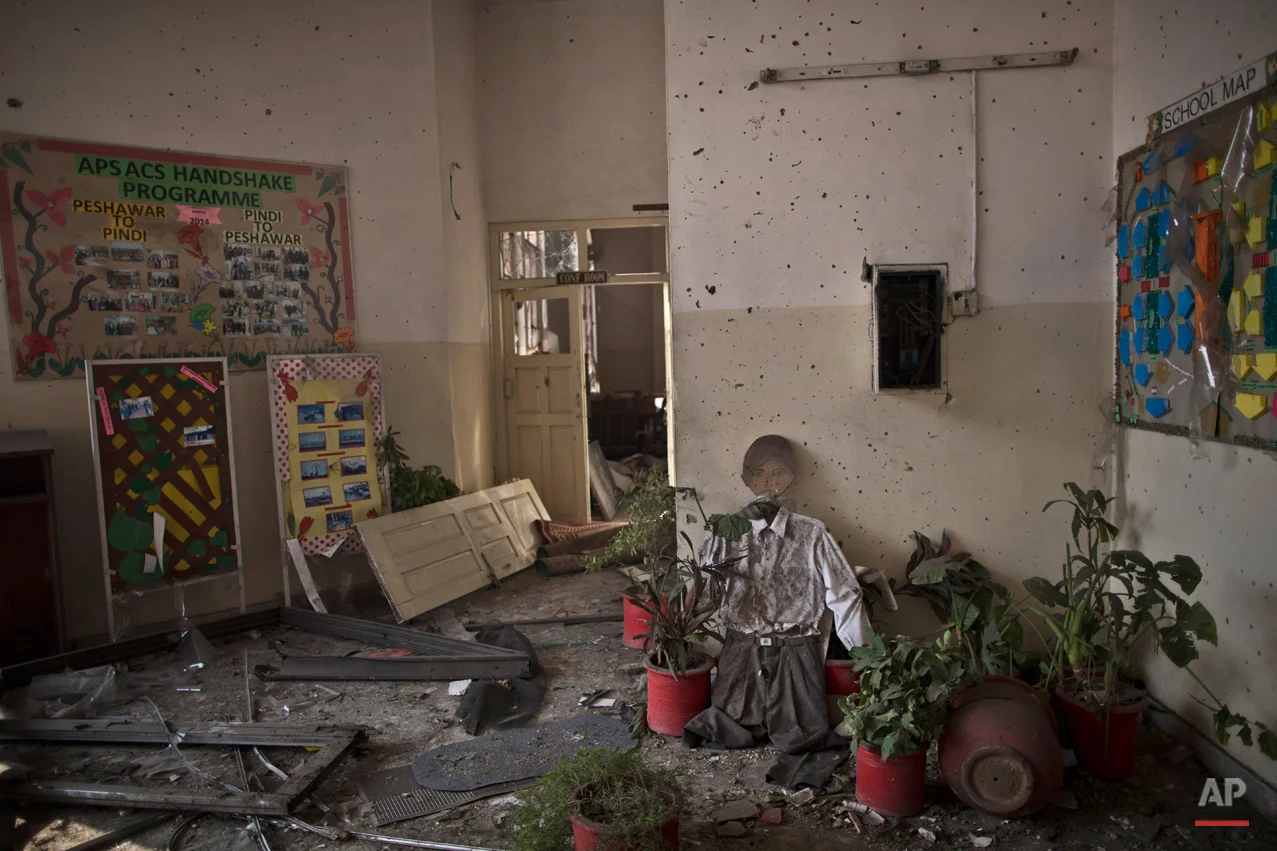 Damages inside the Army Public School attacked last Tuesday by Taliban gunmen, in Peshawar, Pakistan, Thursday, Dec. 18, 2014. The Taliban massacre that killed more than 140 people, mostly children, at a military-run school in northwestern Pakistan left a scene of heart-wrenching devastation, pools of blood and young lives snuffed out as the nation mourned and mass funerals for the victims got underway. (AP Photo/Muhammed Muheisen)