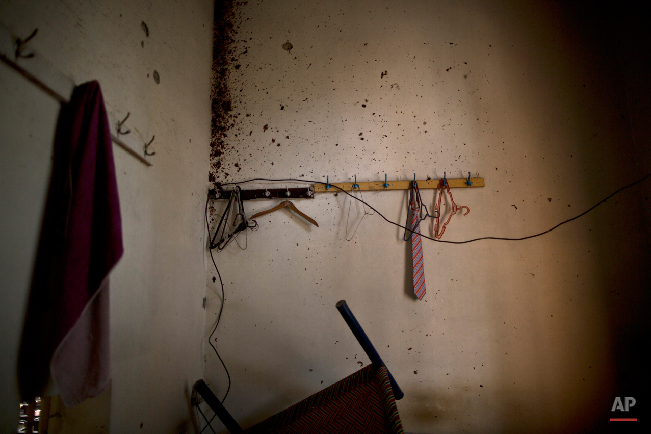  A wall riddled with bullet marks and blood stains, inside the Army Public School attacked last Tuesday by Taliban gunmen, in Peshawar, Pakistan, Thursday, Dec. 18, 2014. The Taliban massacre that killed more than 140 people, mostly children, at a mi