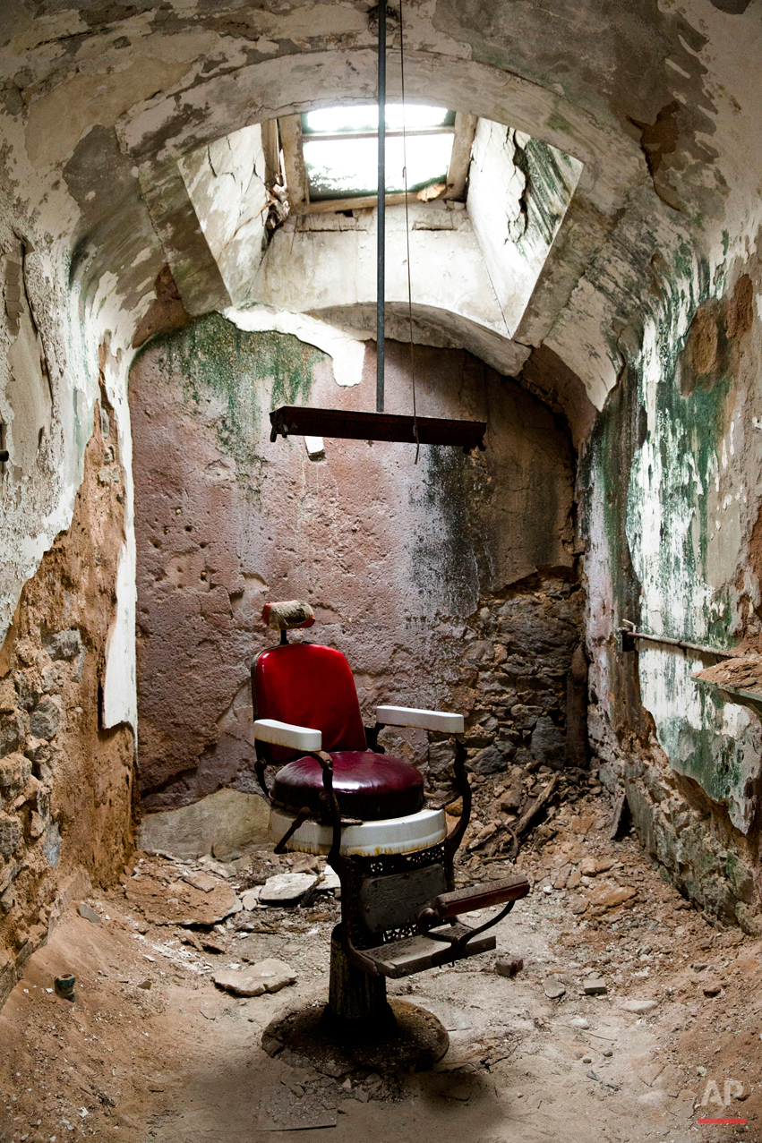  This Oct. 13, 2014, photo shows a barber shop in cellblock 10 at Eastern State Penitentiary in Philadelphia. The penitentiary took in its first inmate in 1829, closed in 1971 and reopened as a museum in 1994.  (AP Photo/Matt Rourke) 