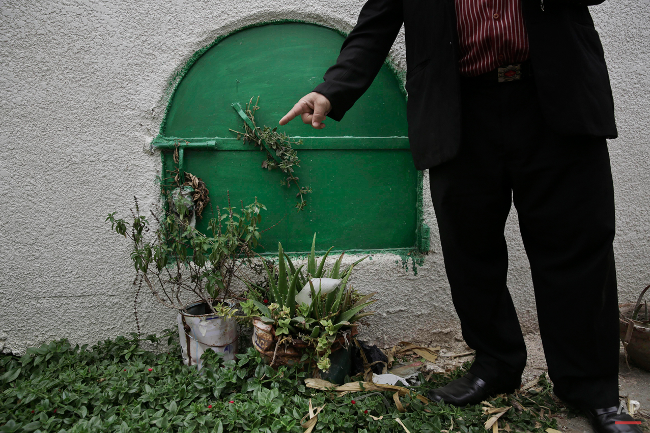  In this Wednesday, Nov. 5, 2014 photo, a man stands in front of the grave of 13-year-old Sohair el-Batea who died undergoing the procedure of female genital mutilation performed by Dr. Raslan Fadl, in Dierb Biqtaris village, on the outskirts of the 