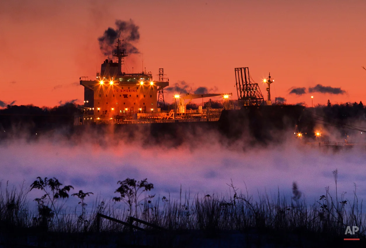 Arctic sea-smoke rises from Portland Harbor where the Bahama-based oil tanker, the Teesta Spirit, unloads it's fuel, Thursday, Jan. 24, 2013, in South Portland, Maine. A stubborn cold front continues to grip the region. (AP Photo/Robert F. Bukaty)