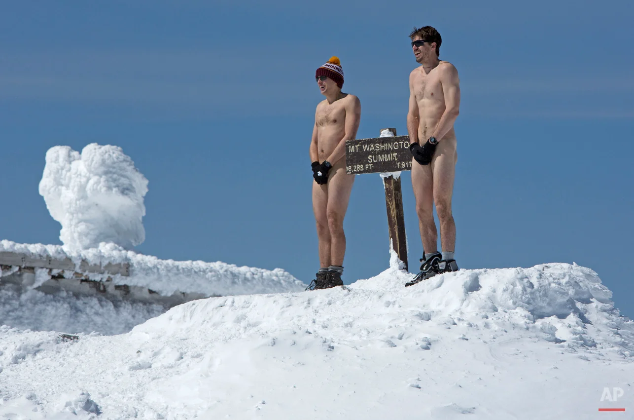A pair of hikers brave 17 degree Fahrenheit temperatures at the summit of 6,288-foot Mt. Washington, Saturday, March 30, 2013, in New Hampshire. The duo, medical students at Columbia University, shed their clothes to streak the final 50 yards to the summit. (AP Photo/Robert F. Bukaty)