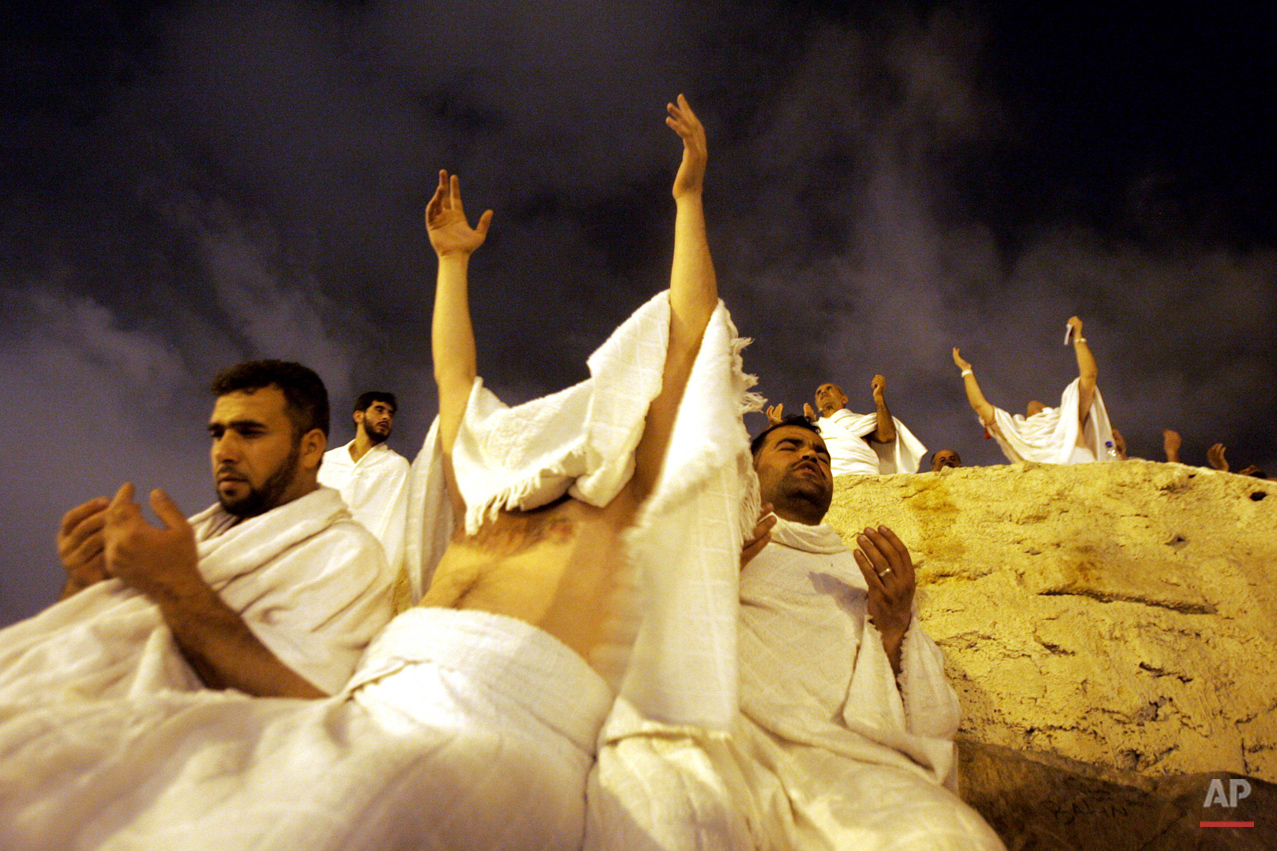  Muslim pilgrims pray at Jabal Al Rahma holy mountain, the mountain of forgiveness, in Arafat outside Mecca, Saudi Arabia early Monday, Jan. 9, 2006. At least 2.5 million pilgrims attended the hajj. The hajj is required at least once in the lifetime 