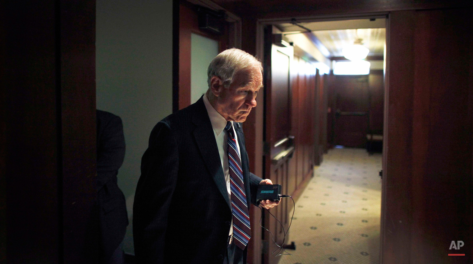  Republican presidential candidate, Rep. Ron Paul, R-Texas walks in a hallway before speaking at a campaign event, Thursday, Dec. 29, 2011, at the Hotel Pattee in Perry, Iowa. (AP Photo/Charles Dharapak) 