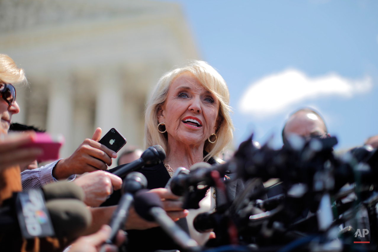  Arizona Gov. Jan Brewer speaks to reporters outside the Supreme Court in Washington, Wednesday, April 25, 2012, after the court's hearing on Arizona's "show me your papers" immigration law. (AP Photo/Charles Dharapak) 