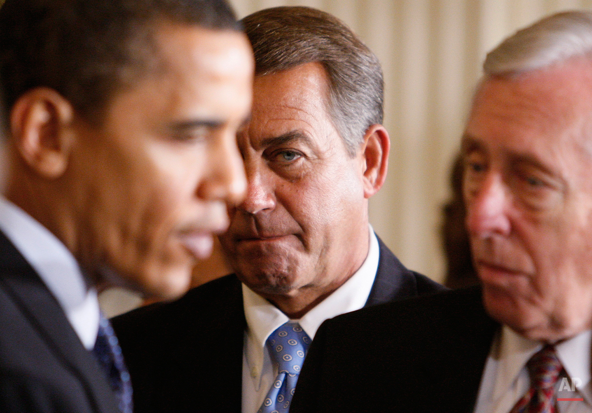  House Minority Leader John Boehner of Ohio, center, looks on as President Barack Obama, left, speaks with House Majority Leader Steny Hoyer of Md., after the president addressed lawmakers as he opened the Fiscal Responsibility Summit, Monday, Feb. 2