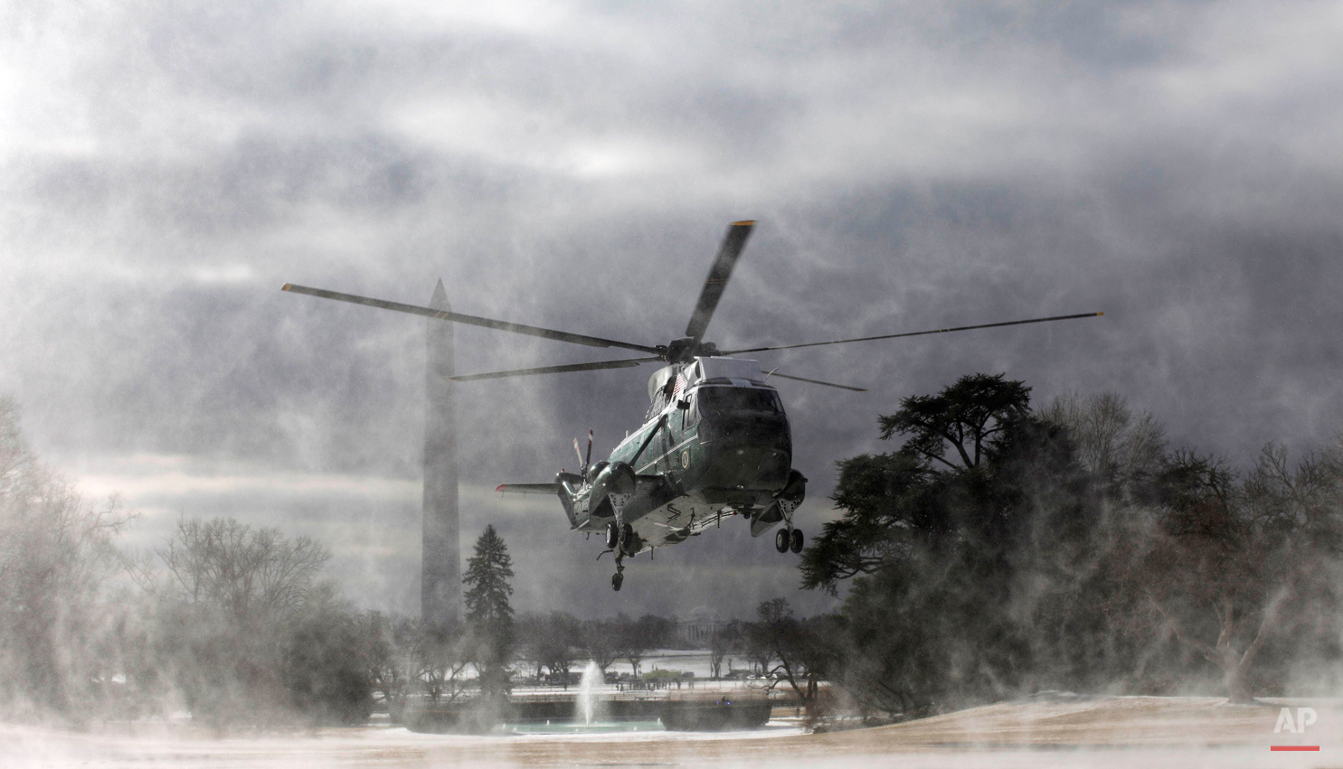  The Marine One helicopter kicks up snow and ice as it lands on the South Lawn of the White House in Washington, Tuesday, Feb. 22, 2011, prior to President Barack Obama's departure to Cleveland, Ohio. (AP Photo/Charles Dharapak) 