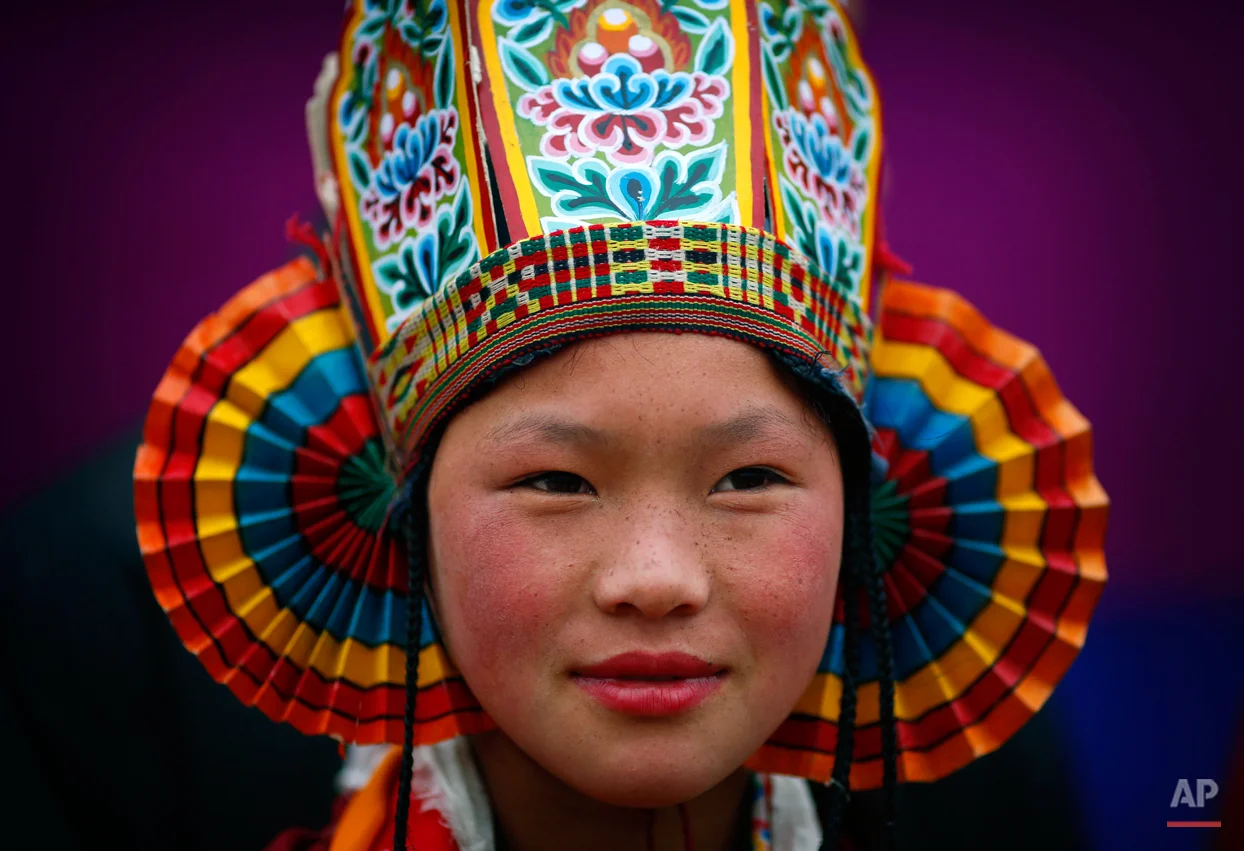 An artist from the northeast Indian state of Arunachal Pradesh wears a traditional costume during a press preview of tableaux displaying a glimpse of culture from different parts of India, in New Delhi, India, Wednesday, Jan. 22, 2014. The tableaux will be part of the Indian Republic Day parade on Jan. 26. (AP Photo/Saurabh Das)