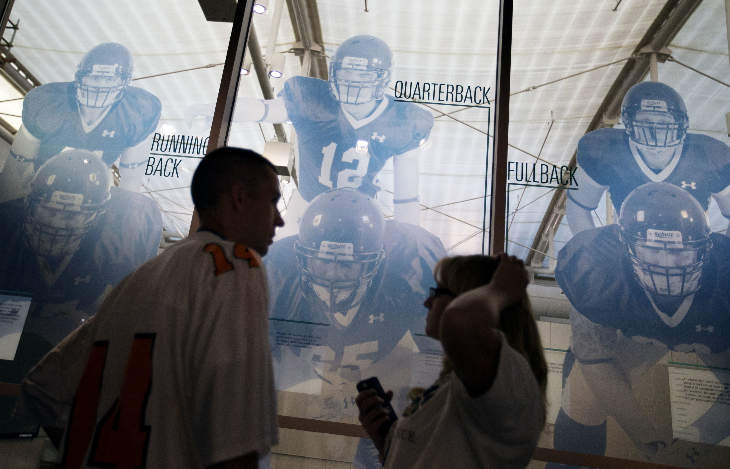  Visitors tour the College Football Hall of Fame before spending the night, Wednesday, Aug. 13, 2014, in Atlanta. One hundred contest winners who wrote an essay detailing their love of college football were selected to stay with a guest overnight in 