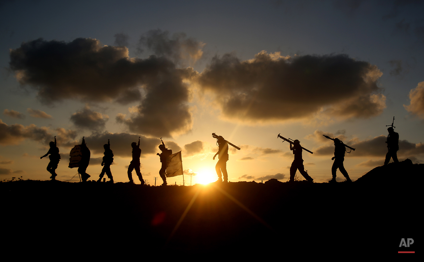  AP10ThingsToSee- Palestinian militants from Mujahideen Brigades, a small military group in Gaza, participate in a training session in Gaza City, Tuesday, June 10, 2014. (AP Photo/Hatem Moussa) 