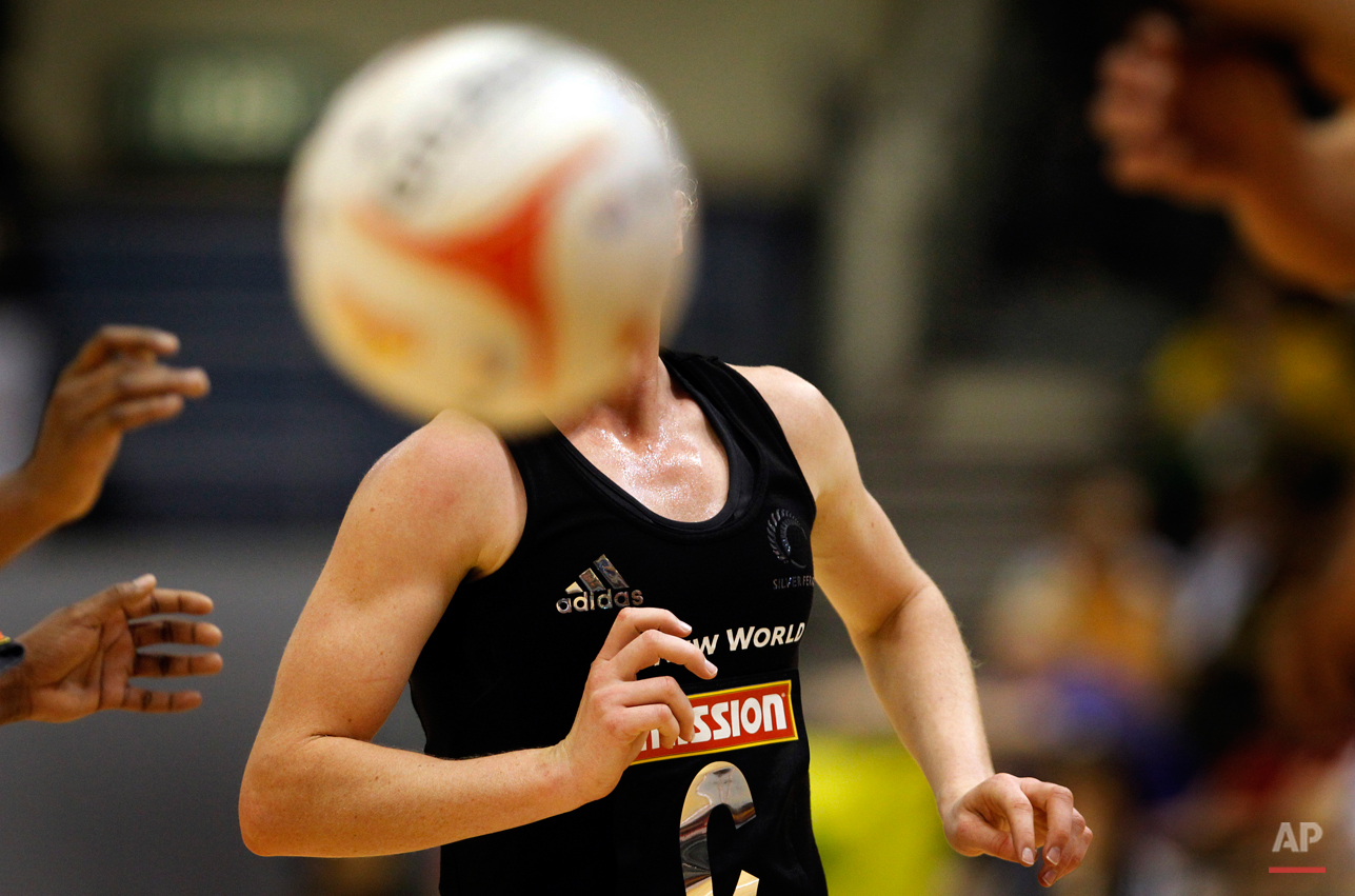  Laura Langman of New Zealand keeps a close watch on the ball while playing against Trinidad and Tobago during the third day of the Mission Foods World Netball Championships held on Wednesday July 6, 2011 in Singapore.(AP Photo/Wong Maye-E) 