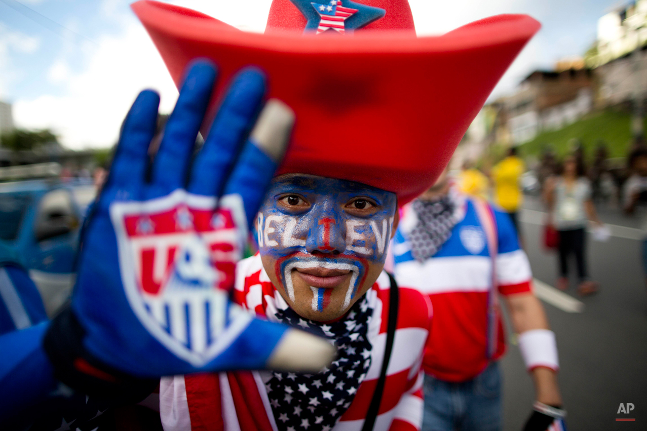  A soccer fan of the United States poses for the picture before World Cup round of 16 match between the U.S. and Belgium outside the Arena Fonte Nova stadium in Salvador, Brazil, Tuesday, July 1, 2014. (AP Photo/Rodrigo Abd) 