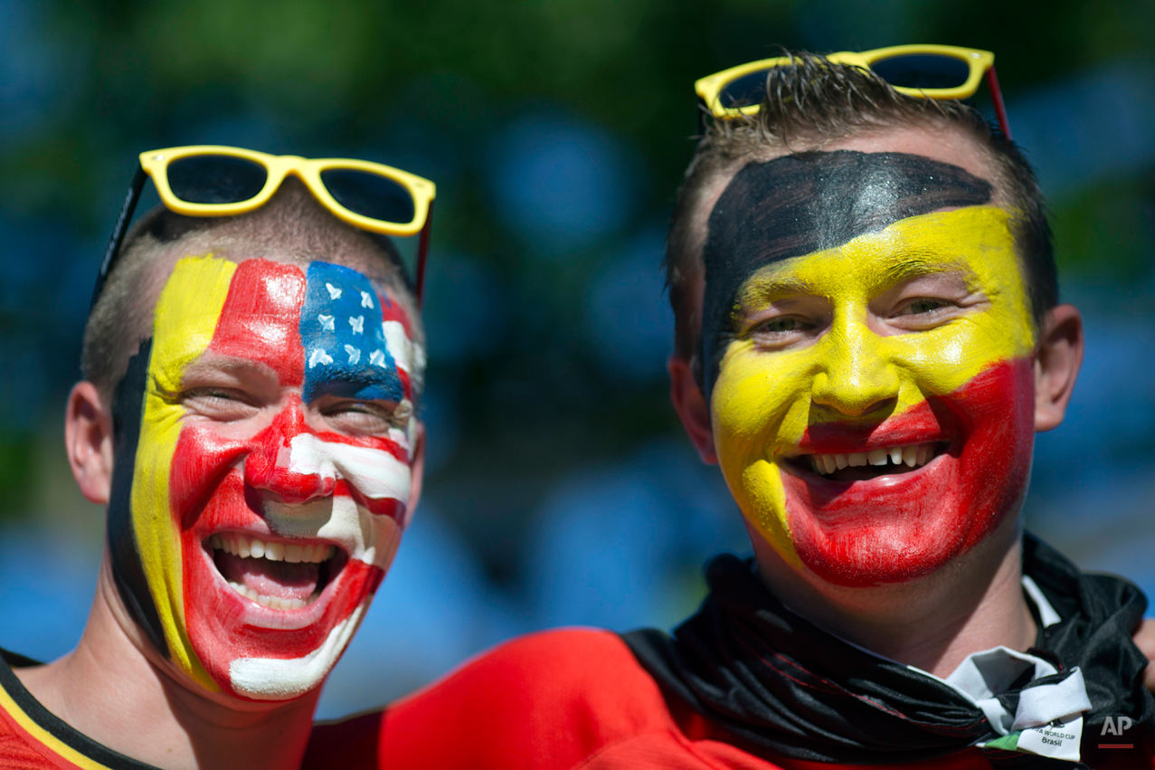  Belgium soccer fans poses for a picture before a World Cup round of 16 match between the U.S. and Belgium outside the Arena Fonte Nova stadium in Salvador, Brazil, Tuesday, July 1, 2014. (AP Photo/Rodrigo Abd) 